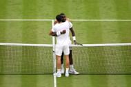 Carlos Alcaraz and Frances Tiafoe hugging each other after their third-round match at the 2024 Wimbledon Championships